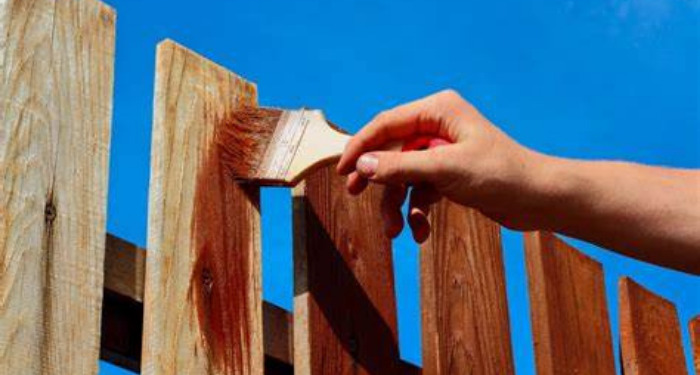 painting a fence